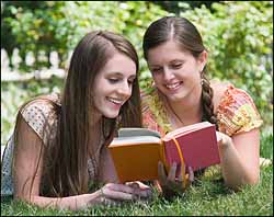 two-caucasian-girls-with-book