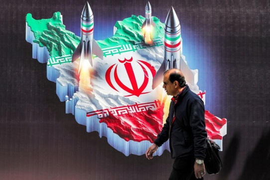 banner depicting missiles launching from Iran